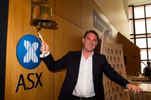 John McGrath in happier times, ringing the bell as his real estate company floated on the ASX. 