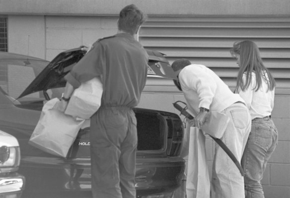 Police officers and detectives with evidence confiscated from the house of then prime suspect, the backpacker killer Ivan Milat after raiding his home in Cinnabar Street, Eagle Vale Taken on 22 May 1994.