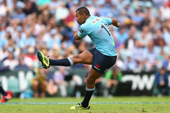 Kurtley Beale of the Waratahs kicks a goal