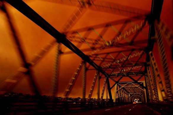 Blood red sky over Tom Uglys bridge in South Sydney. Photo by Chris Lane