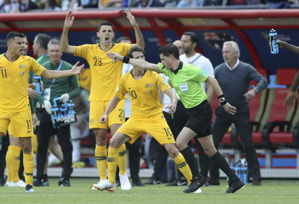 Spot fire: The Socceroos react after referee Andres Cunha consults VAR on the penalty.