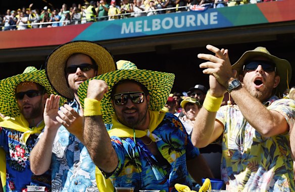 Australian supporters cheer their team on against New Zealand during the Cricket World Cup final in Melbourne, Australia, Sunday, March 29, 2015. 
