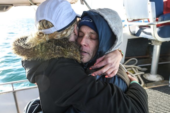  A cold and exhausted Grant is congratulated by girlfriend Kate.