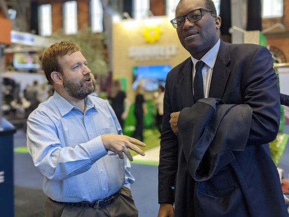 US pollster Frank Luntz speaks to British cabinet minister Kwasi Kwarteng at the Conservative Party Conference in Manchester last year.