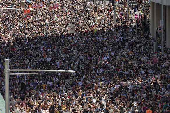 Protestors perform a sit-in on Elizabeth Street in Sydney's CBD  
