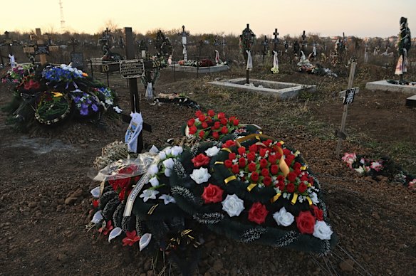 The grave of Artem Mardziavko at the Meshkovske cemetery in Mykolaiv. Artem was killed from injuries sustained when a missile hit his apartment building. 
