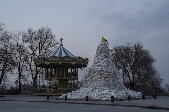 The monument of the Duke of Richelieu is covered with sandbags next to a Carrousel in Odesa, Ukraine.