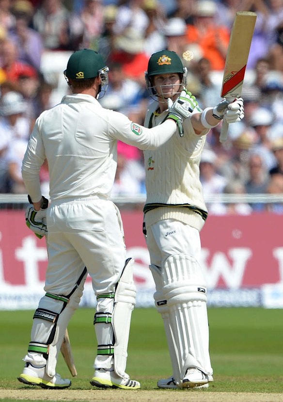 Australia's Steven Smith (R) celebrates scoring a half century (50 runs) during the second days play of the first cricket Test match of the 2013 Ashes series between England and Australia at Trent Bridge in Nottingham.