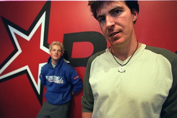 Former AFL footballer and now director of the Reach organisation, Jim Stynes and fellow staffer, Jules Lund, who is a facilitator, at the Collingwood office, December 5 2002.