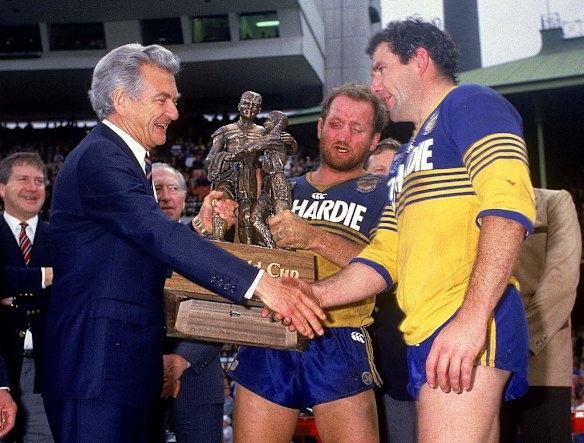 Bob Hawke congratulates Ray Price and Michael Cronin of the Eels after the 1986 NSWRL grand final.
