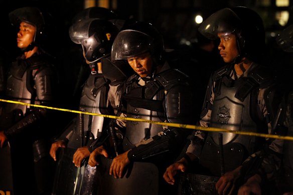 Indonesian riot squad police guard the enterance to Kerobokan Prison as Bali Nine duo Myuran Sukumaran and Andrew Chan are transferred.