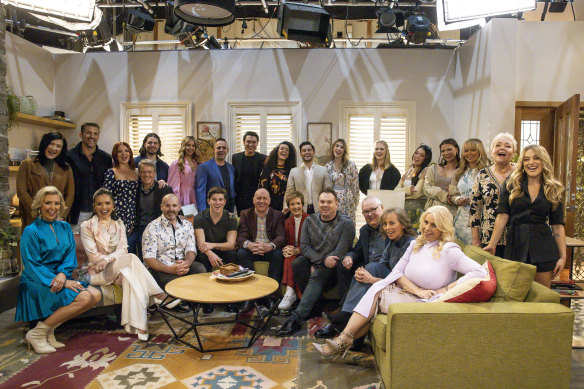 Neighbours cast members, including long-time stars Ryan Moloney, Alan Fletcher and Jackie Woodburne (front row), on the set for the show’s last days of filming.