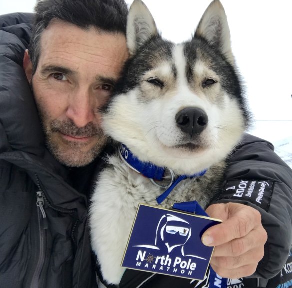 Marcus Fillinger with his faithful dog Duro after their epic effort in the North Pole Marathon.