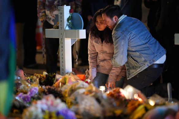 People attend a candlelight vigil on November 21 following a mass shooting at a nearby gay bar in Colorado Springs.