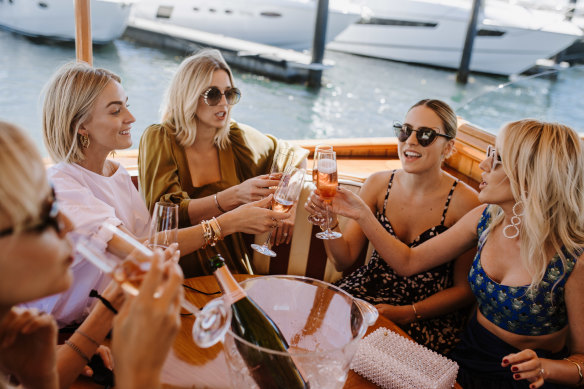 Nadia Fairfax, Jasmine Yarbrough, Deborah Symond and Montarna McDonald arrive by yacht at a lunch to celebrate the launch of THE UPSIDE X NADIA FAIRFAX collection at Vaucluse Yacht Club on Wednesday.