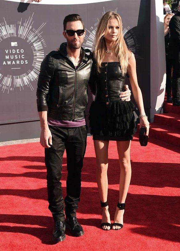 THE CASUAL: Although not outstandingly bad, Adam Levine and his gorgeous wife Victoria's Secret model look dressed to hit the town on any given Saturday night, rather than red carpet ready. Both Adam's jacket and Behati's dress are bound to be real leather, but somehow manage to look cheap as chips. It's all just very so-so, thoughts?