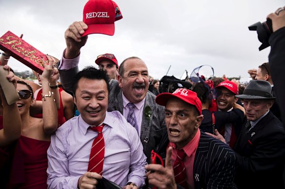 Punters celebrate Redzel winning the TAB Everest horse race held at Royal Randwick Racecourse.