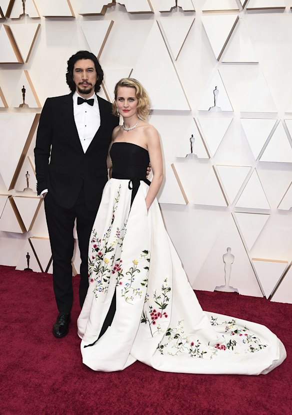 Adam Driver, left, and Joanne Tucker arrive at the Oscars.