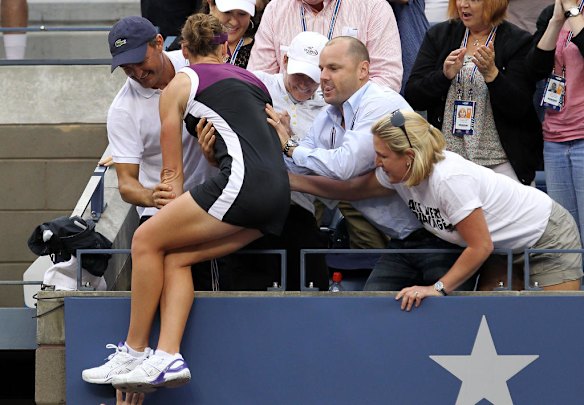 Samantha Stosur of Australia jumps into her player box while celebrating her win over Serena Williams in the US Open women's singles final.
