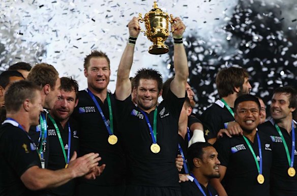 Richie McCaw of the All Blacks lifts the Webb Ellis Cup.