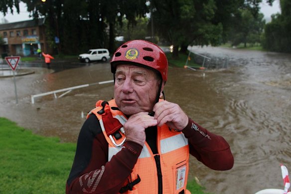 A SES swift water rescue member prepares beside Cooma Creek.