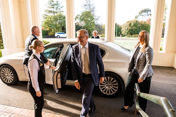 Anthony Albanese arrives at Government House to be sworn in as the 31st prime minister. He is accompanied by his partner, Jodie Haydon. 