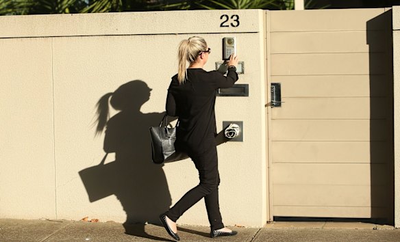 A woman is seen entering the Avondale Heights home.
