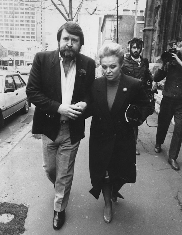 Derryn Hinch leaves court in 1986 with his then wife, Jacki Weaver.