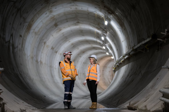 Jacinta Allan (right) and a Metro Tunnel worker in 2021. Allan was then minister for transport infrastructure and is now premier.