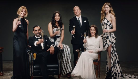 Cheers: Harper's Bazaar editor-in-chief Kellie Hush, far left, raises her glass for David Jones' 180th birthday, with store ambassadors Adam Goodes, Jessica Gomes, Neil Perry, Victoria Lee, and Vogue editor-in-chief Edwina McCann, sitting, far right.