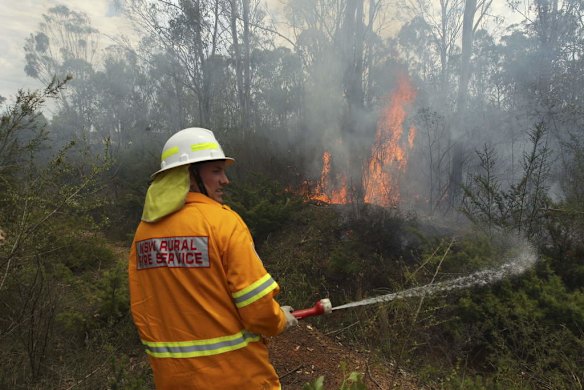 NSW Rural Fire Service and NSW Fire Rescue crews tackle a deliberately lit bushfire near Bidwill in Sydney's west.
