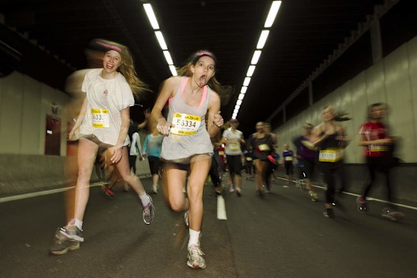 City 2 Surf: Runners making their way through William Street tunnel.