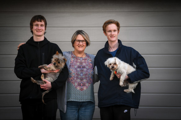Bernie Bergin with her sons Xavier (left), in year 9, and Patrick, in year 11, are navigating their fifth stint of remote learning. 