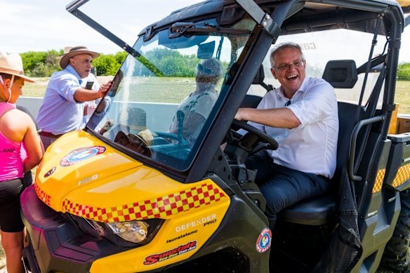Another vehicle prop: Morrison takes a rescue buggy ride at the Bribie Island Surf Life Saving Club. 