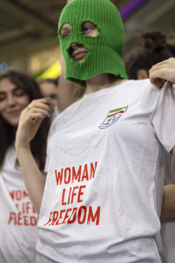 A group of young women, some wearing colorful balaclavas, identified themselves as members of the Pussy Riot collective while in the stands on Wednesday.