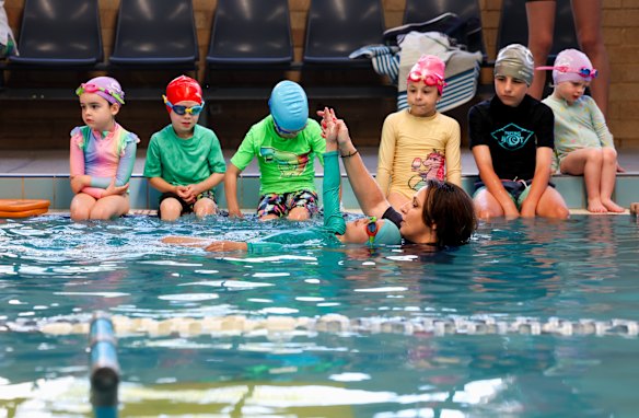 Clotilde Doxaras, swim school manager at C&M Aquatic Centre, teaching children to swim.
