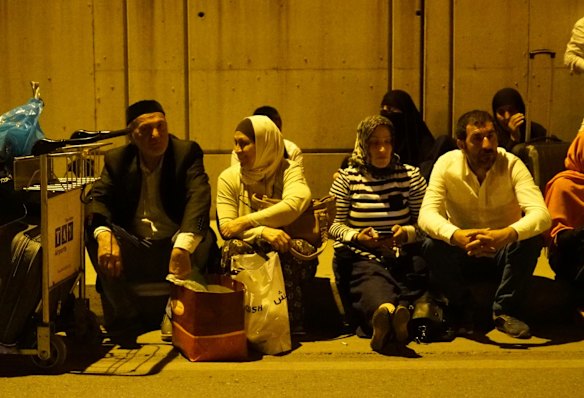 Passengers wait outside Turkey's largest airport, Istanbul Ataturk, after the suicide bomb attacks in Istanbul, Turkey.