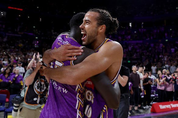 Happy days: Xavier Cooks and teammate Makuach Maluach celebrate the Kings’ championship series win over the Adelaide 36ers this year.