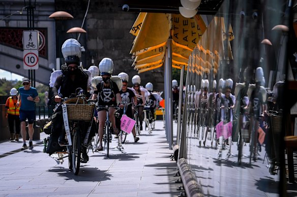 Earlier on Saturday, skeletons clutching briefcases full of money had cycled from the Melbourne CBD to St Kilda, in order to highlight the “failure” of this week’s COP26 climate summit in Glasgow, Extinction Rebellion’s spokeswoman Jane Morton said at the protests.