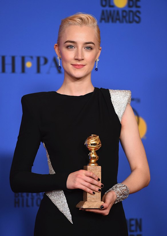 Saoirse Ronan with the Golden Globe for best actress in a motion picture (musical or comedy) for her performance in <i>Lady Bird</i>.