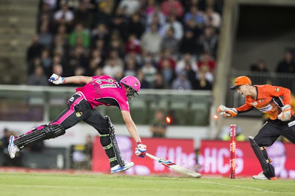 Moises Henriques of the Sydney Sixers run out for 77 on the last ball of the match.