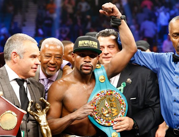 Still unbeaten: Floyd Mayweather jnr celebrates his unanimous decision win over Manny Pacquiao.