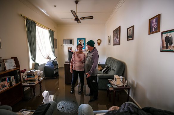 Glenys and Brian in their flooded lounge room.