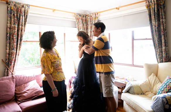 Our Lady of Mercy College student Daphne Fong with her parents Daphne and her mother had driven half-an-hour to Fairfield from their Winston Hills home to purchase it just weeks prior. "I knew it was the one. I wanted to get it ASAP, because you don’t want double-ups," she says.