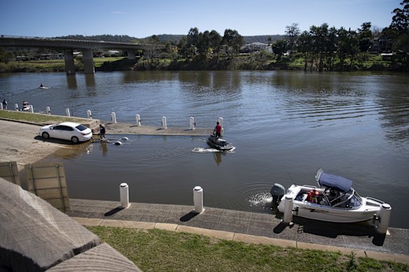 People load water craft onto the Nepean River at Penrith, as temperatures are expected to reach 29 degrees this weekend.