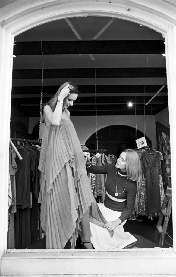 Carla Zampatti dresses a model at her store in Surry Hills, Sydney, July 1975. 