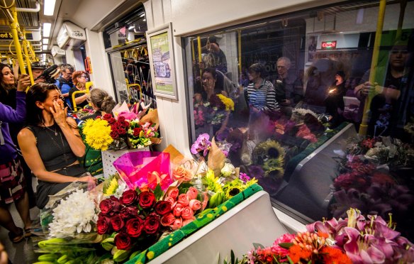 Flowers on an 86 tram to be delivered to the scene of the death in Bundoora for a vigil.