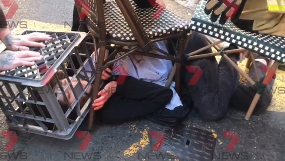 A screenshot from 7 News showing the citizens' arrest of man who allegedly tried to stab people in Sydney.