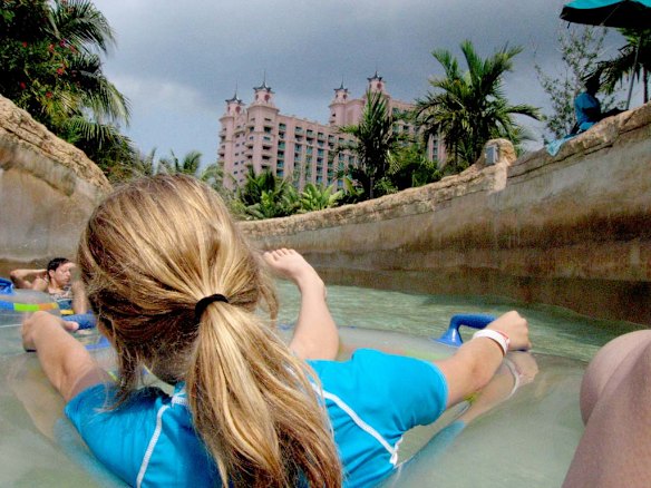 Visitors get a ride through rocky tunnels and over rapids on the mile-long Current at the Atlantis Paradise Island Resort in the Bahamas. 