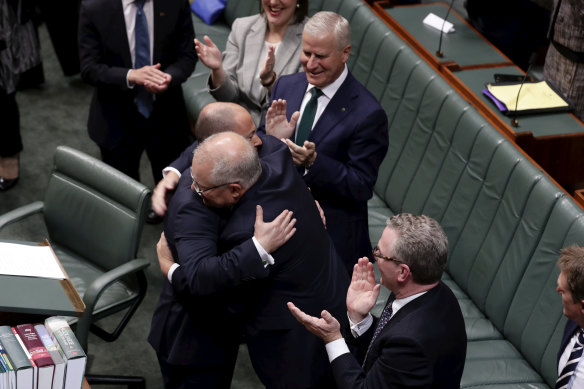 Treasurer Josh Frydenberg is congratulated by Prime Minister Scott Morrison after delivering the Budget speech in the House of Representatives at Parliament House in Canberra on Tuesday 2 April 2019.